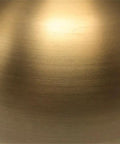 Close-up of brushed brass finish on Go To 68 Inch Tall Arc Floor Lamp With Glass Shade In Brushed Brass And Milk White
