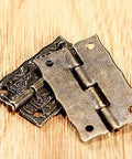 Antique Bronze Iron Hinge Set 36x23mm 10 Pieces Vintage Flower Pattern Decorative Hardware on wooden surface