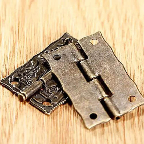 Antique Bronze Iron Hinge Set 36x23mm 10 Pieces Vintage Flower Pattern Decorative Hardware on wooden surface