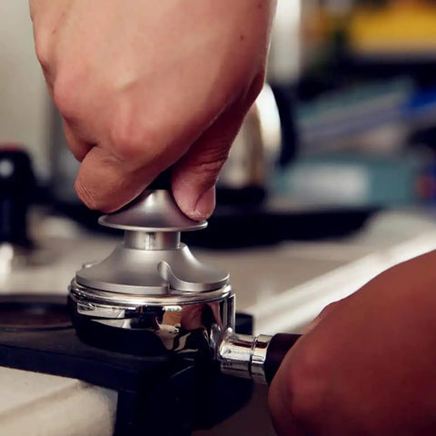 Top Tier 51mm Stainless Steel Coffee Tamper With Adjustable Calibration And Anti Deviation Base For Consistent Espresso Compaction in use.