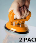 Two Pack 5 Inch Suction Cup Lifting Tool Set With 110 Lb Vertical Lift And 130 Lb Horizontal Pull For Glass Tiles Mirrors And Smooth Surfaces Beefed Up For Heavy Duty Home Improvement Projects Tile Replacement Glass Handling being used on glass