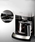 Fully Automatic Coffee Machine For Home Or Commercial Use Built Tough With Food Grade Stainless Steel Dual Purpose Drip Espresso Maker Light Gray Countertop Brewer close-up of brewing carafe and lid detail.