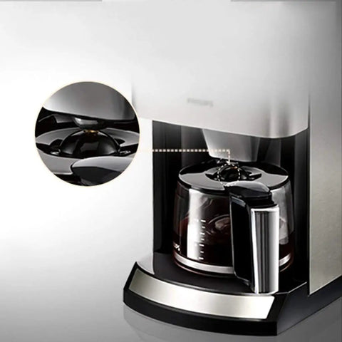 Fully Automatic Coffee Maker For Home And Kitchen Brewing Rich Flavor Fast With Food Grade Stainless Steel Body close-up of brewing area and glass carafe.