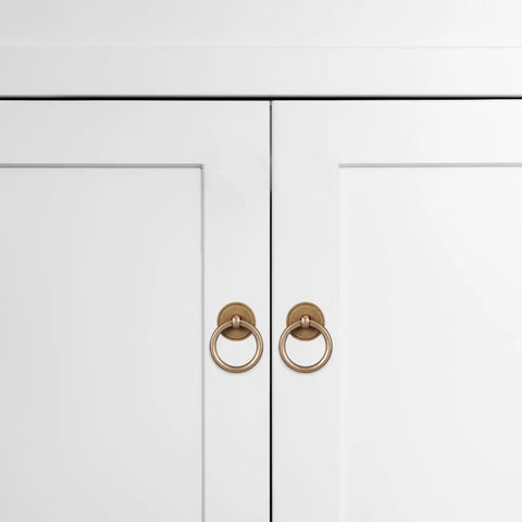 Set Of Four Vintage Brass Cabinet Ring Pulls With Solid Antique Brass Drawer Handles on white cabinet doors