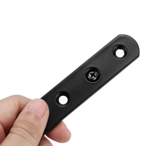 Eight Piece Stainless Steel Mending Plates 4 Inch Square Corner Brackets With Matching Screws For Heavy Duty Furniture Repair And Quick Fixes Built Rock Solid No Hassle Design Black Finish Secure Grip, black metal plate held in hand.