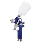 Sprocky Hvlp Gravity Feed Paint Sprayer With 1MM Nozzle And 100Ml Cup featuring a white cup and blue body for precise painting.