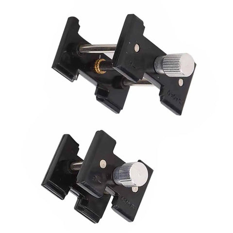 Two Piece Watch Movement Holder Kit With Non Slip Fixed Base and Plastic Repair Tool for watchmakers, shown in black plastic.