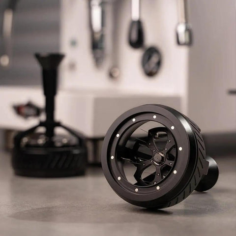 58mm Espresso Wdt Tool Dial Into Your Shot Game And Keep Grinding Strong With 14 Precision Needles lying on a counter.