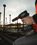 Worker using 18V Brushless Dual Mode Impact Driver And Wrench With 1800 In Lbs Torque And 4200 IPM on construction site