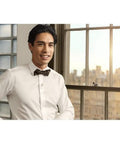 Person wearing a Lavalier Lapel Microphone For Filmmaking And Content Creation, Crisp Broadcast Quality Audio For On Camera, indoors.
