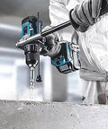 Heavy Cordless 40V Max XGT Brushless Combi Drill Featuring Fast Dual Speed Settings Smooth Variable Trigger in use drilling concrete.