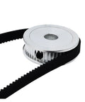 Heavy Duty HTD 3M Synchronous Timing Belt Pulley Featuring Eighty Teeth And Twenty Five Millimeter Bore with belt attached.