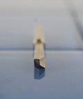 Close-up of a quarter inch solid carbide drill extractor for broken taps and damaged bolts with self centering point, straight flutes.