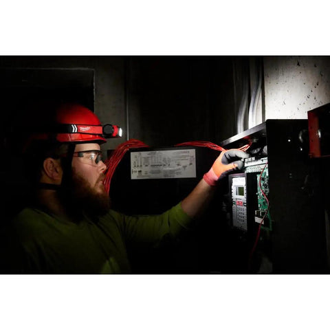 Worker wearing RedLithium USB Hard Hat Headlamp With LED Power 2163-21 Includes One Battery And One Charger