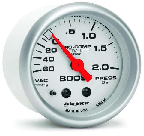 Front view of Auto Meter Ultra-Lite mechanical boost/vacuum gauge, 2.3125 in, white dial, red needle, metal housing.