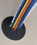Construct Pro Speedy Spring-Lock cable pass-through port, black, 2-in ID, installed in concrete with colored cables.