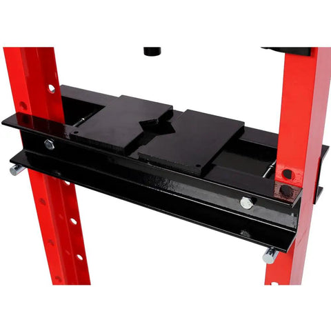 Close-up of a red 12 Ton Hydraulic Shop Press With Gauge Bottle Jack For Bending Straightening And Pressing Metal Components Bearings U Joints Bushings And Pulleys Adjustable Ram With Overload Valve Red with metal frame and adjustable support.
