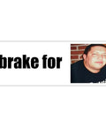 Bumper sticker with bold black i brake for text on white background and a portrait photo of a man on the right.