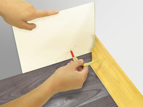 Using Awesome Nifty Pencil Compass and Scriber for precise circle marking on paper with wood backdrop.
