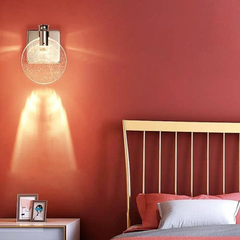 VCDUXMQLK Nordic Luxury Crystal Bedroom Wall Lamps LED Light Source Three-Color Dimmable Sconces mounted on red wall.