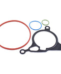 Front view of MOTOKU vacuum pump rebuild kit: 4-piece set with red large O-ring, blue and green seals, black gasket.