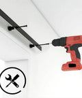 Installing the Budget Friendly Six Foot Sliding Barn Door Hardware Kit For One Wood Door using a drill, showing the track and screws.