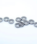 Totally Sick Pack Of 10 Flanged Deep Groove Ball Bearings MF106ZZ Chrome Steel ABEC-1 Miniature Size 6x10x3mm arranged on white background.