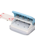 Handheld Three Hole Paper Punch With Scrap Collector Workhorse Five Sheet Capacity Five Point Five Millimeter Holes And Nineteen Millimeter Spacing