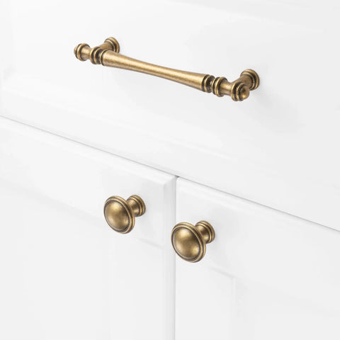 Slick Antique Brass Cabinet Pulls 10 Pack, 5 Inch Top Tier Solid Metal Drawer Handles on white cabinets.