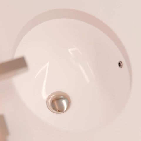 Top view of Oval Undermount White Porcelain Sink With Brushed Nickel Drain Set And Overflow Pop Up Drain Sealer Solid Brass Overflow