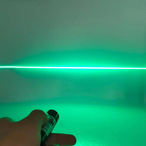 520nm green laser line module, hand-held, emitting a horizontal alignment line.