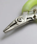 Close-up of Pliers And Hook Fishing Multitool With Line Cutter For Saltwater And Freshwater Use, showing metal jaws and grip