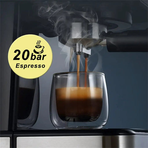 Slick Electric Coffee Maker With Auto Milk Frother For Thick Cappuccino And Hot Latte Brews Stainless Steel Core Removable Water Tank Easy Drain Drip Tray brewing espresso with steam rising from glass cup