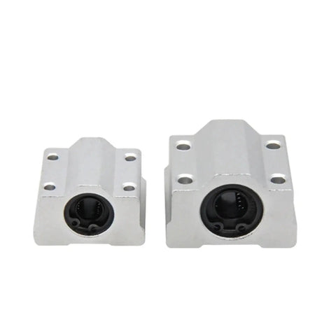 Hardened Steel Guide Blocks for Four Pack Linear Motion Bearing Slides, showing two sizes with smooth bushings, ideal for CNC setups.