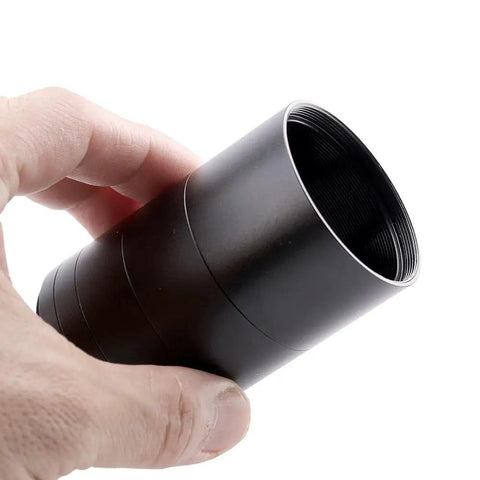 Hand holding 2-Inch M48 Extension Tube Kit With 5 Rings For Backfocus, Eyepiece Projection And Flatteners, metal detail view