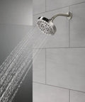 6 Setting Chrome Shower Head With High Pressure Spray 6 Inch Round Design Delivers Intense Full Body Shower And Convenient Pause Feature 1.75 GPM Flow on tiled wall