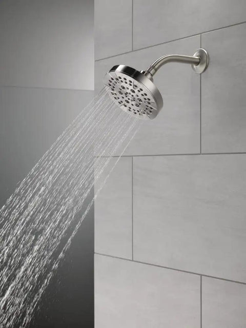 6 Setting Chrome Shower Head With High Pressure Spray 6 Inch Round Design Delivers Intense Full Body Shower And Convenient Pause Feature 1.75 GPM Flow on tiled wall