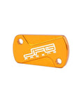 Premium 6061 T8 Aluminum Front And Rear Brake Fluid Reservoir Cover Cap Set For RM125 RM250 2001 2008 RMZ250 2007 2022 RMZ450 2005 2022 RMX450Z 2010 2017 Dirt Bike Gold Finish showing front side of gold cover with branding.