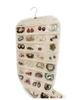 Double Sided Hanging Jewelry Organizer Bag With Eighty Clear Storage Pockets For Earrings Necklaces And Brooches Portable Closet Accessory Holder filled with earrings.