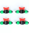 Set of four Irrigation In Line Barbed Shut Off Valve With Locking Fitting for half inch drip tape tubing against white background.