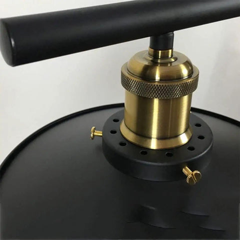 Close-up of Top Tier Industrial Led Chandelier With Reliable Pulley Pendant Setup showing brass component and black finish.