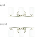 Three Light Vanity Light Fixture In Brushed Nickel With White Glass Shades For Bathroom Vanity Lighting 21 Inches Long E26 Base Delivers Dope Sleek Modern Look For Any Bath shown in upward and downward positions