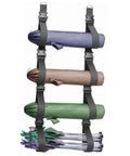 Heavy Duty Adjustable Wall Storage Straps With Badass Rugged Buckles holding yoga mats and tent poles for organized garage storage.