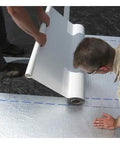 Heavy Duty Self Stick Roll Roofing Gray Waterproof Peel and Seal Tape for RV Trailer Homes Low Slope Pitch Roofs Killer Seal with 45 Mil Thickness being installed on a roof.