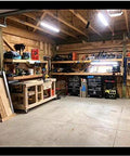 Well-organized workshop with wooden workbenches and tools, featuring 2 inch swivel caster wheels for mobility and versatility.