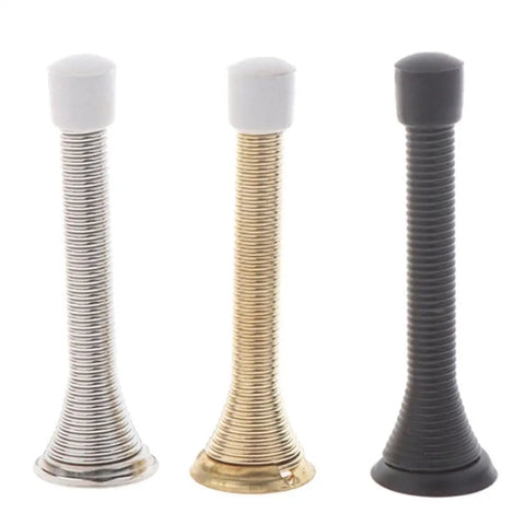 Three metal door stoppers with white rubber tips in silver, gold, and black finishes shown in a vertical standing position.