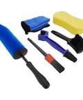 Motorcycle Wheel Cleaning Stand With Cleaning Brush Kit Universal Roller Paddock contains various brushes and cleaning tools.
