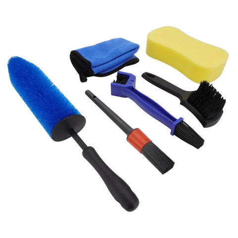 Motorcycle Wheel Cleaning Stand With Cleaning Brush Kit Universal Roller Paddock contains various brushes and cleaning tools.