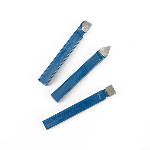 Three blue carbide lathe tool bits from the ten piece one quarter inch carbide lathe tool bits set for metal cutting.