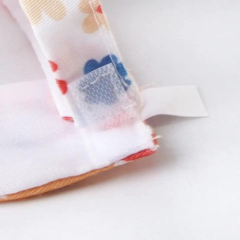 Close-up of Anti Pinch Design Bird Flight Suit for Parrots with adjustable Velcro closure and colorful polyester fabric